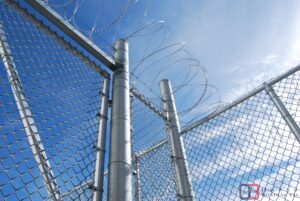 can you get a probation violation header photo. This image shows a prison fence with barbed wire and the Owens Bonding logo in the right corner. 