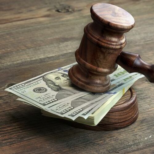Close-up Of Judges Gavel, Soundboard And Bundle Of Dollar Cash On The Rough Wooden Table. Concept For Corruption, Bankruptcy Court, Bail, Business Or Financial Crime, Bribing, Fraud, Auction Bidding
